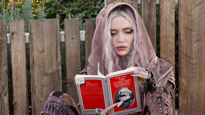 Grimes Photographed Reading Karl Marx Following Split From Elon Musk