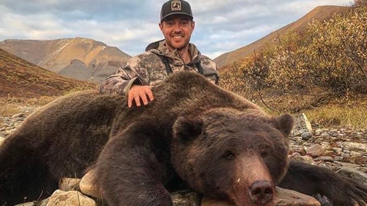 Hunter Receives Vicious Death Threats After Posing With Huge Bear He Killed