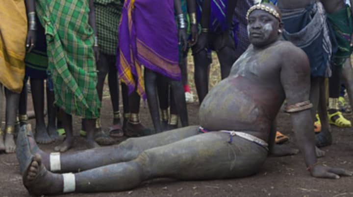 Ethiopian Tribe Have A Ritual Where Men Compete To Put On Weight