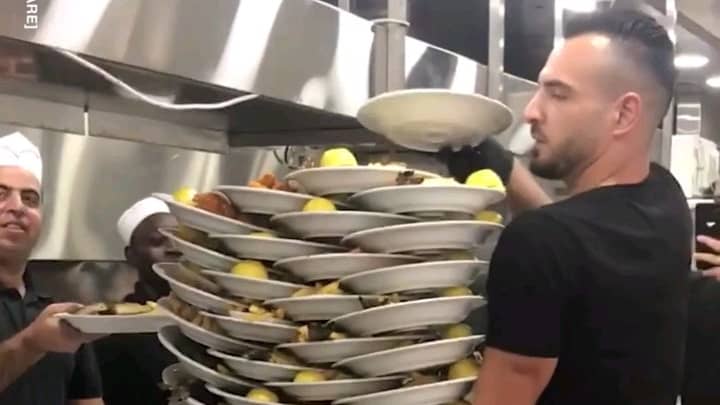 Waiter Shocks Restaurant By Carrying 33 Plates At Once