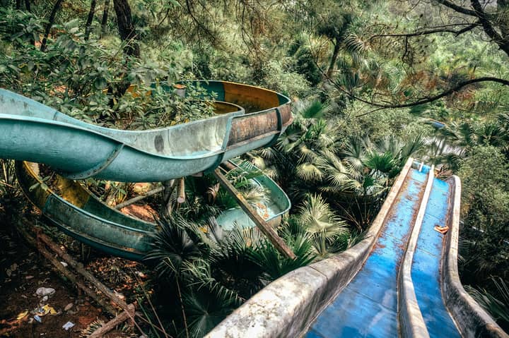 Take A Look Inside The Spooky Abandoned Water Park That's Overrun With Vines