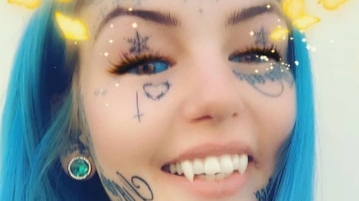 Woman Transforms Herself Into 'Blue Eyes White Dragon' With Fangs