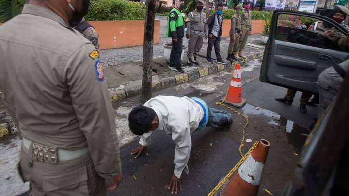 Indonesian Men Forced To Do Press Ups For Not Wearing A Mask