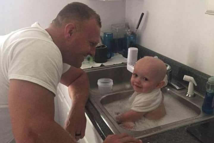 Cops Rescue Baby 'Covered In Vomit' From Drunk Mother And Wash Him In Police Station Sink
