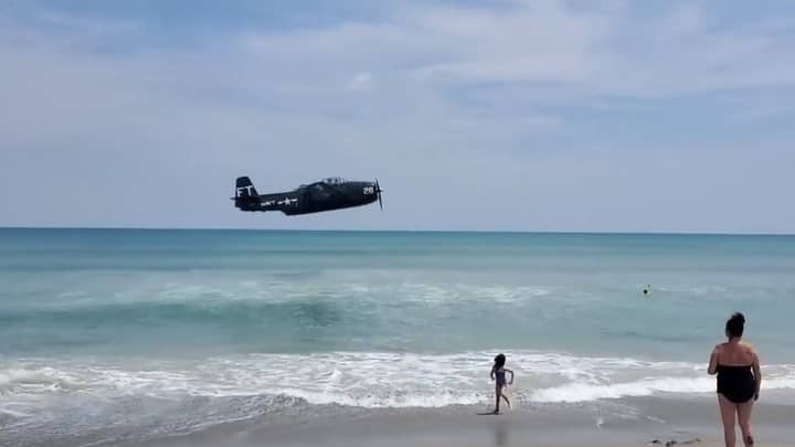 World War Two Plane Crashes Into Sea Close To Shore On Busy Beach
