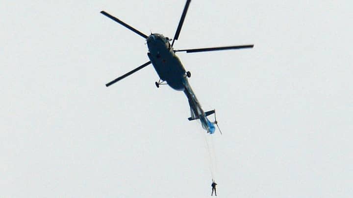 Parachutist Left Dangling From Helicopter After Chute Snagged