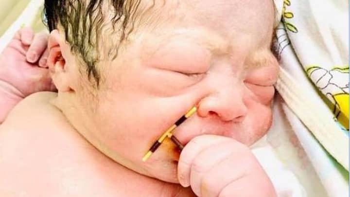 Picture Of Newborn Baby Holding Mum's Failed Coil Goes Viral