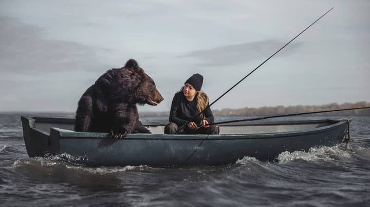 Woman Goes Fishing In Boat With Rescued Brown Bear