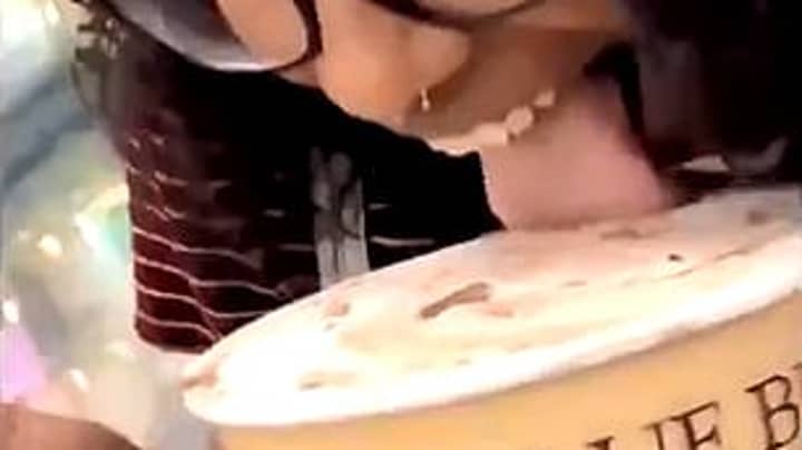 Woman Licks Open Tub Of Ice Cream Then Puts It Back In The Shop Fridge For Prank
