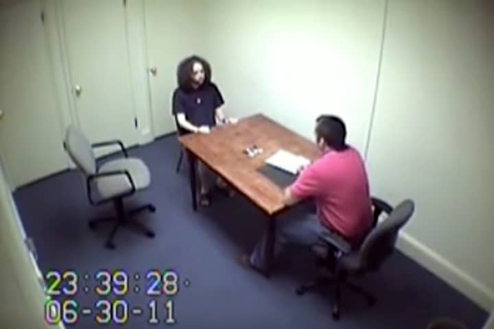 Murderer Who Was Caught On Live News Broadcast Keeps Body Eerily Still During Police Interview