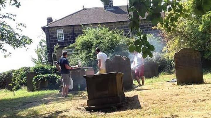 People Furious After Group Photographed Having Barbecue On Tombstone In Church Cemetery