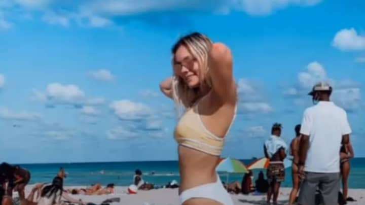 Woman Shares Hilarious X-Rated Optical Illusion In Beach Snap