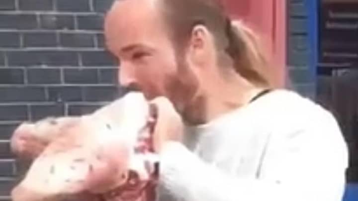 Man Eats Raw Pig's Head In Protest Outside Vegan Food Festival