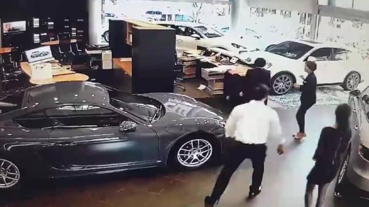 ​Angry Businessman Crashes £100k Porsche Into Dealership 