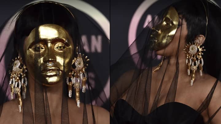 Cardi B Shocks American Music Awards Red Carpet With Gold Mask 