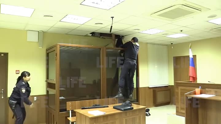Crazy Moment Russian Killer Tries To Escape Through The Ceiling In Court