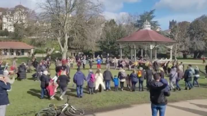Police Disperse Large Crowd Of Children And Adults Doing Hokey-Cokey Dance