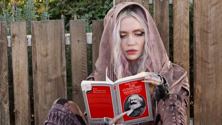 Grimes Responds After Being Photographed Reading Karl Marx Book