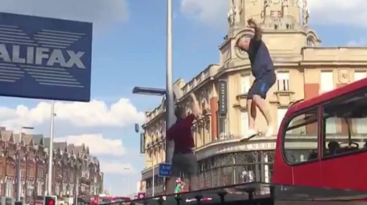 England Fan Crashes Through Bus Stop Roof After Leaping From Bus
