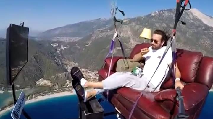 Paragliding Instructor Takes To The Skies On A Couch 