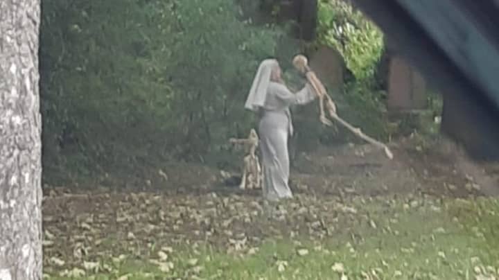 'Nun' Photographed Dancing With Skeleton Model In Graveyard 